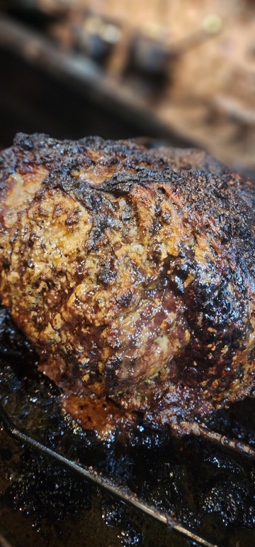 Roast Beef with Crispy Crust: Close-up of a roasted beef with a crispy crust